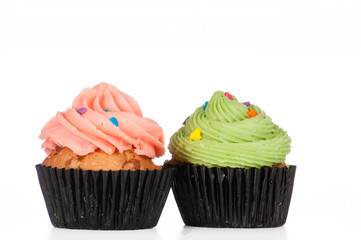 Delicious cupcakes isolated on white background