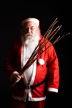 Der Weihnachtsmann mit Rute Stock-Foto | Adobe Stock