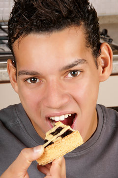 Young Man Eating Fruit Tart