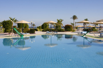 Swimming pool on a sunny day. Hurghada city in Egypt.