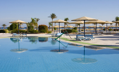 Swimming pool on a sunny day. Hurghada city in Egypt.