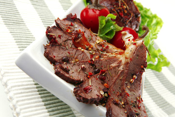 beef meat slices on ceramic plate