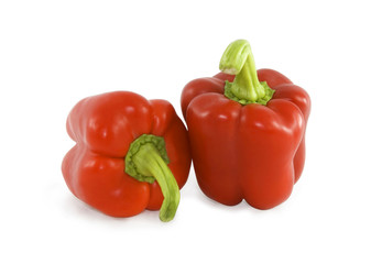 Red sweet peppers over white background
