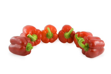 Red sweet peppers over white background