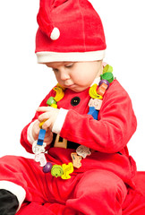 Baby wearing Santa suit