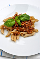 home made pasta with mince sauce and basil
