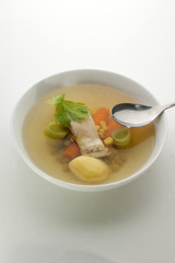 carp fish soup with fresh organic herbs