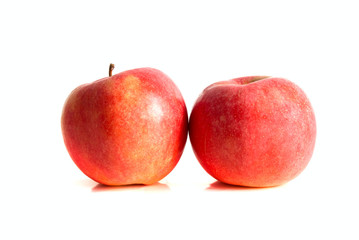 Two ripe red apples isolated over white