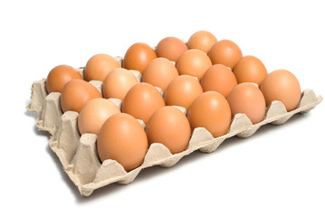 Box with twenty eggs isolated over white