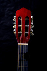 Close up of the head of a guitar..