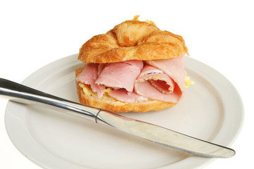Ham croissant on a plate