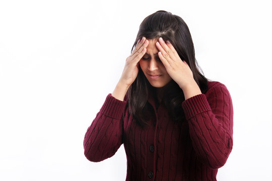 Woman suffering a migraine headache