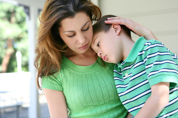 Tired boy at Home with Mother