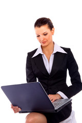 pretty business woman looking at laptop..