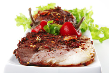 served roast steak on plate