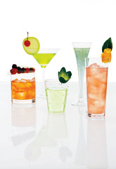 different mixed drinks dressed up with fresh fruits