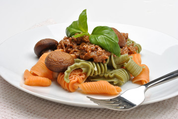 home made pasta with mince sauce and basil