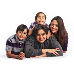 Latino family of four isolated smiling