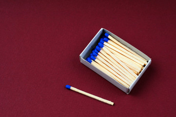 Opened boxes of matches on a color background