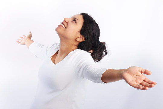 Woman praising with arms raised in the air