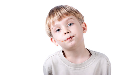boy with chocolate on the face  isolated