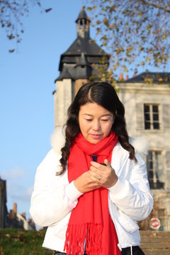 Chinese girl with mobile phone in France