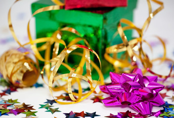 Green box, pink rosette and gold ribbon