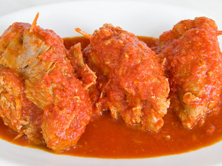 Meat roulade with tomato sauce on plate