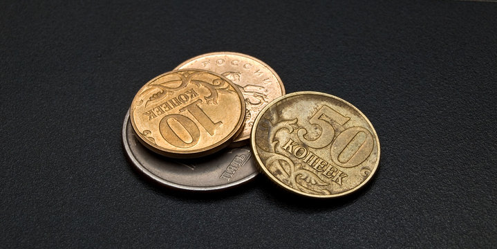 Some modern russian copeck coins on the dark background