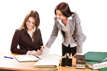 Two young women at desk