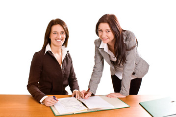Two young women at desk