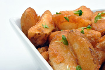 some fried potato wedges in a bowl