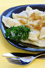 Cabbage dumplings with fried onion