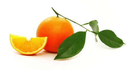 Ripe oranges with green leaves.