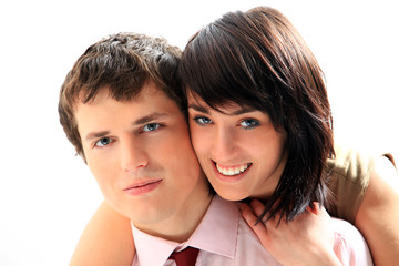Young love couple smiling. Over white background