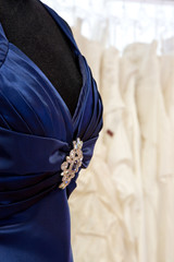 Dress with brooch.
