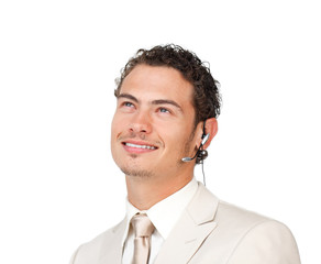 Young businessman with headset on looking up