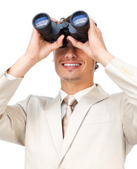 Visionary businessman looking through binoculars