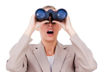 Surprised businesswoman looking through binoculars