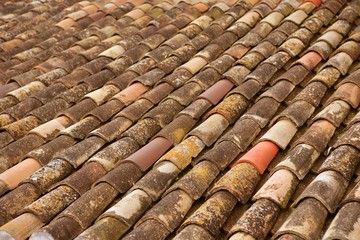 Aged old clay arabic roof tiles in rows