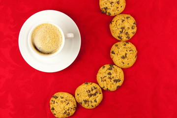 Coffee and cookies on a red background