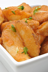 some fried potato wedges in a bowl