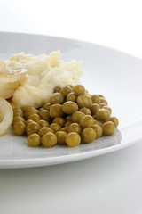 mash potato with organic pea on a plate