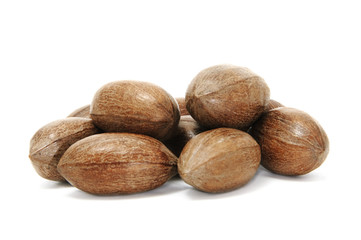 brown pecan nuts on the white background