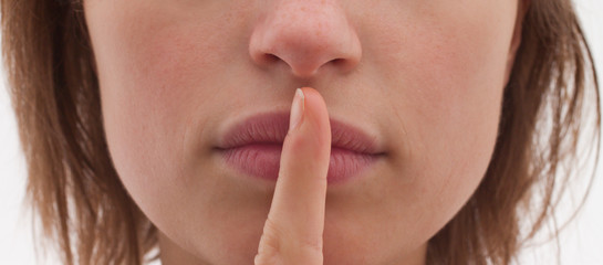 Shh - Cut out of woman with finger to lips