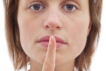 Naklejka premium Silence - Cut out of woman with finger to lips
