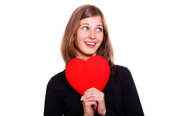 young woman holding a red heart over white background