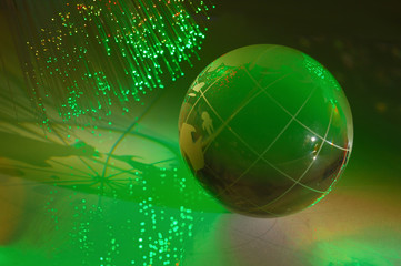 hi-tech earth globe against fiber optic background