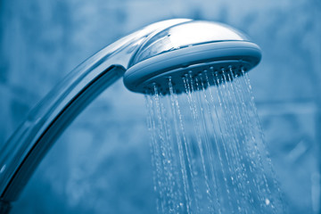 Fototapeta na wymiar water flowing from metal shower