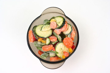 a bowl with assorted frozen vegetables